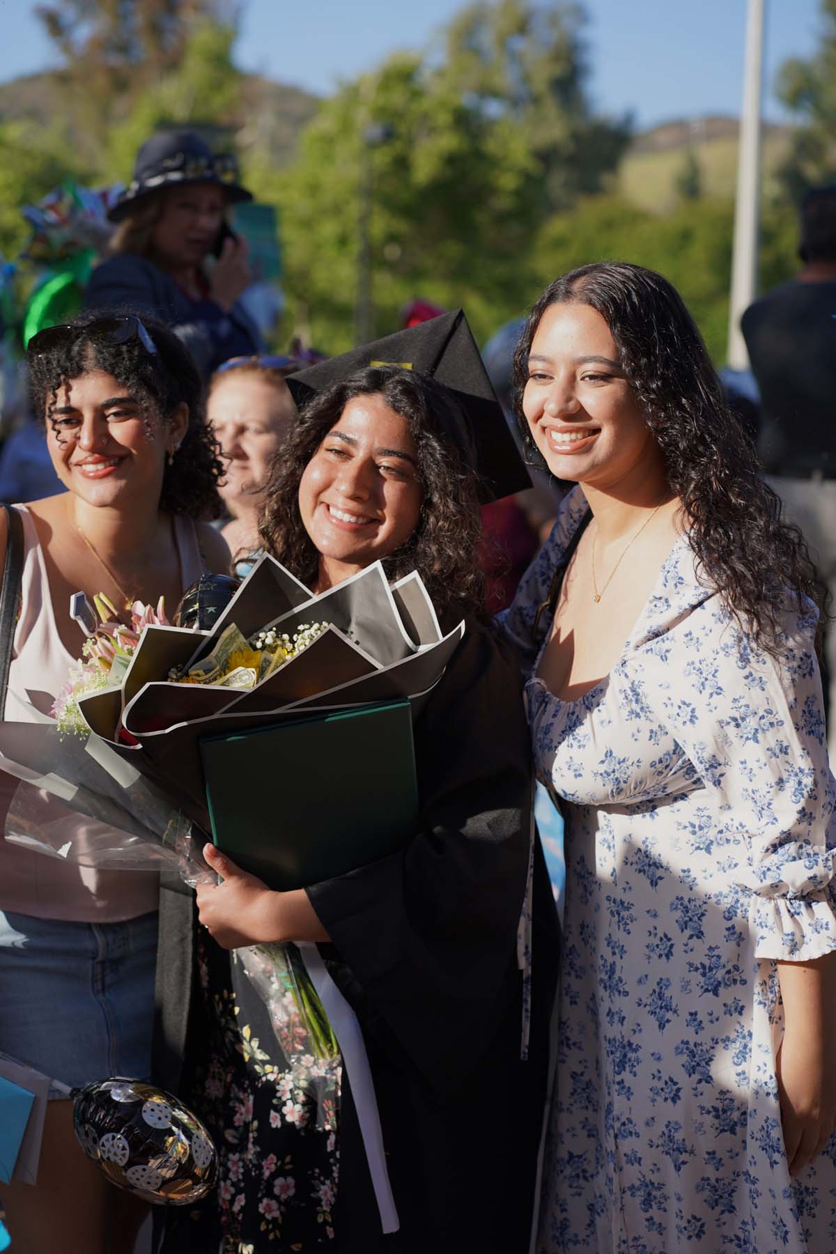 Grad recession at Commencement 2025 and pictures with family members.
