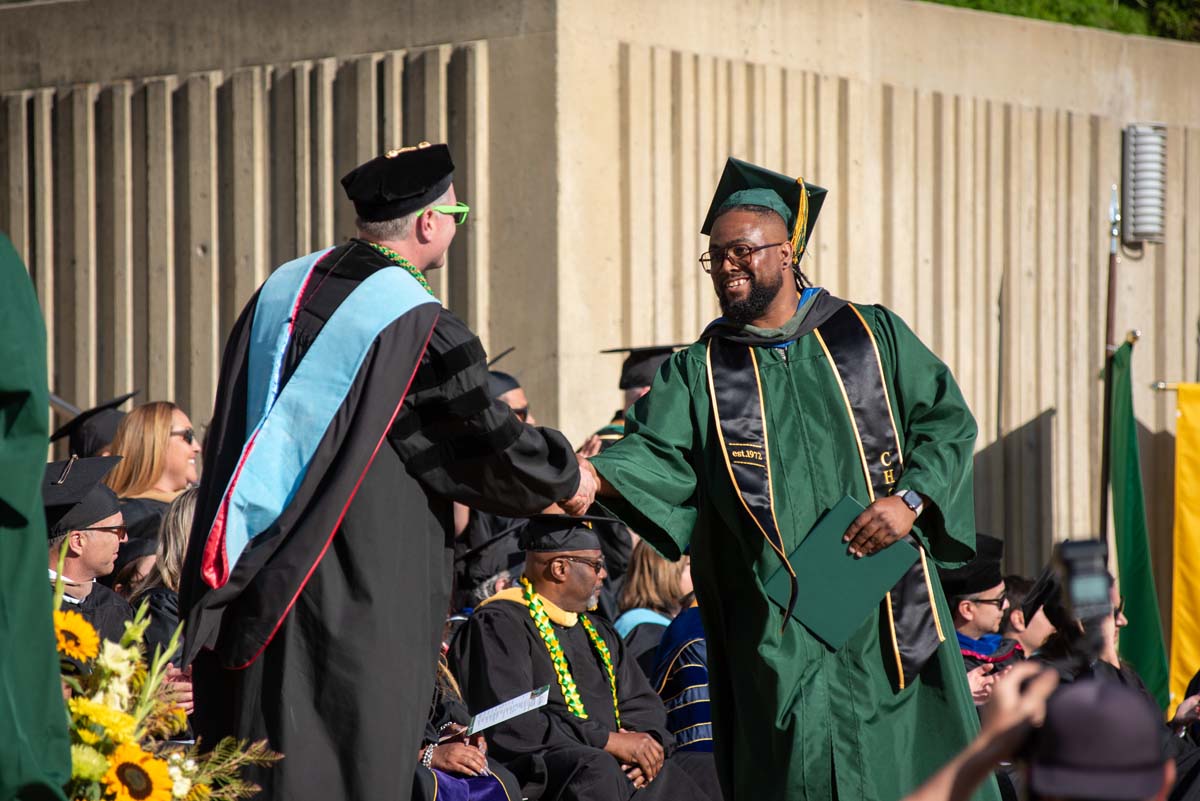 Grads walk across stage at CHC Commencement 2025.