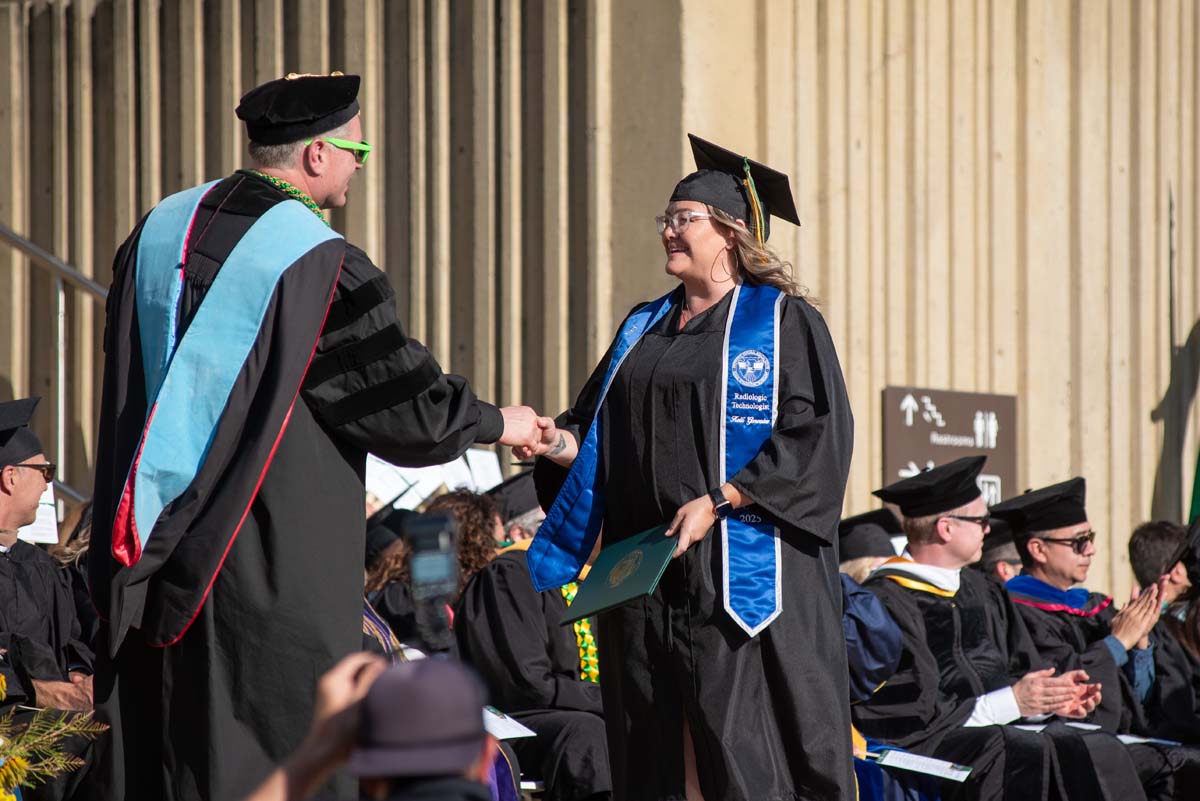 Grads walk across stage at CHC Commencement 2025.