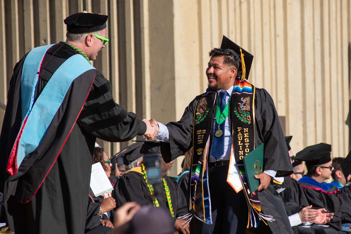 Grads walk across stage at CHC Commencement 2025.