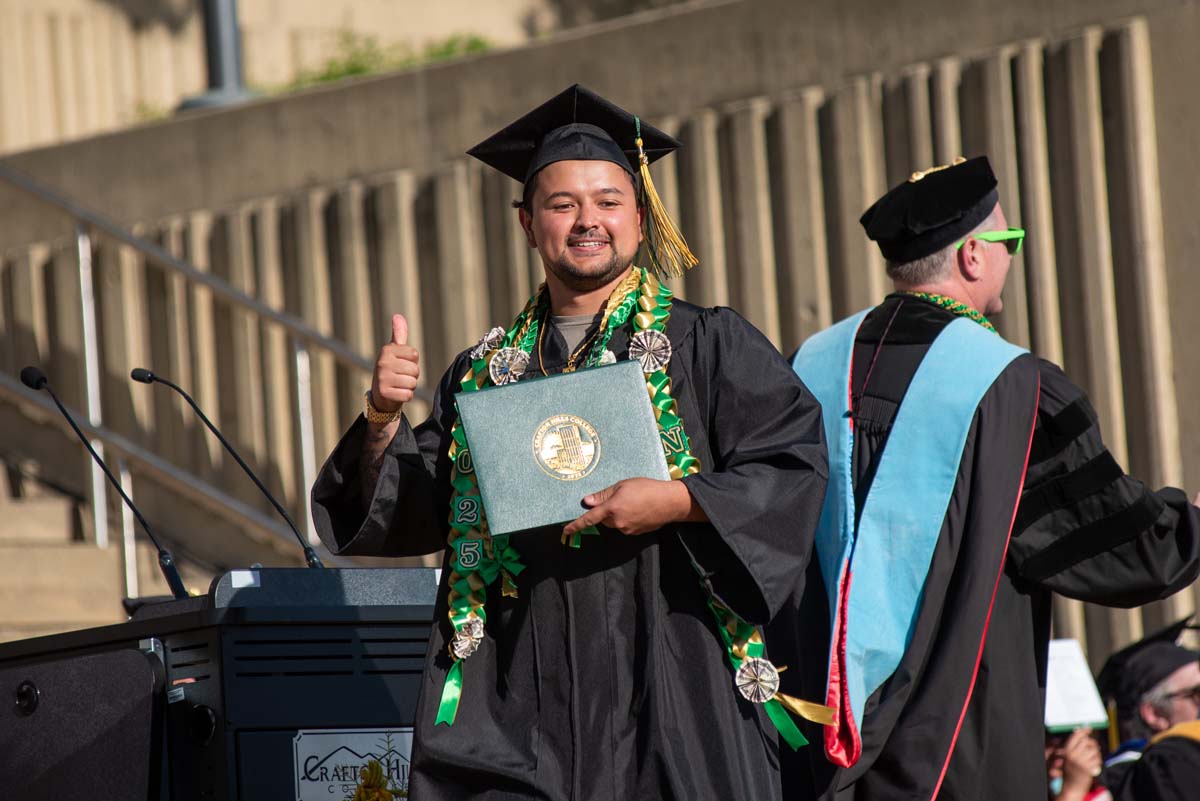 Grads walk across stage at CHC Commencement 2025.