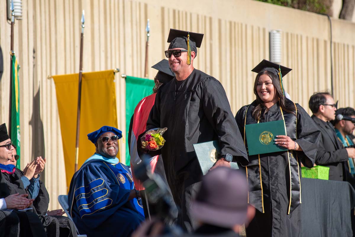 Grads walk across stage at CHC Commencement 2025.
