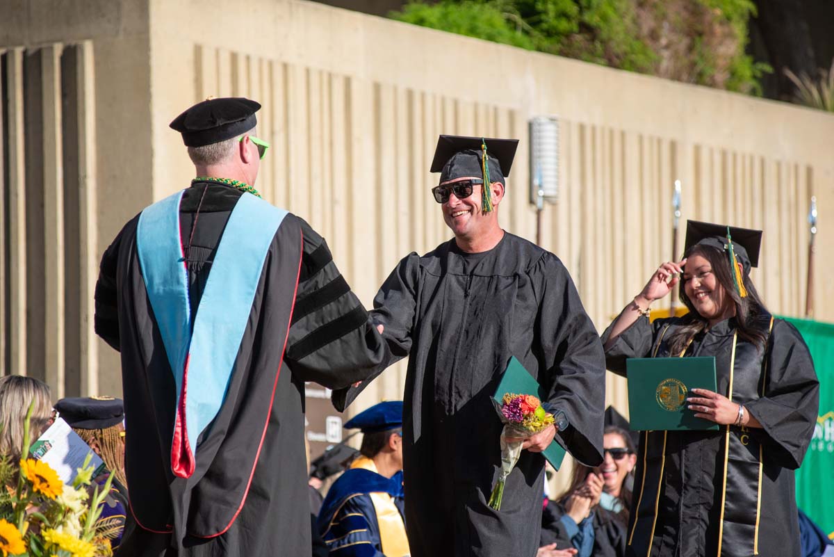 Grads walk across stage at CHC Commencement 2025.