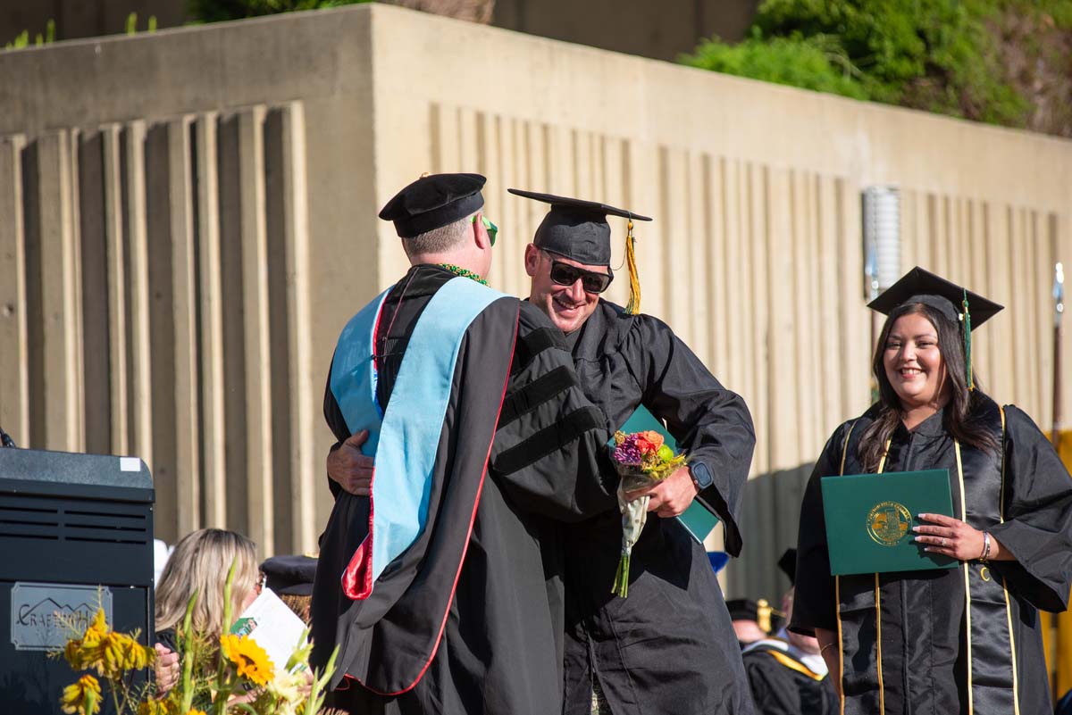 Grads walk across stage at CHC Commencement 2025.
