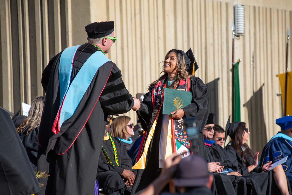 Grads walk across stage at CHC Commencement 2025.