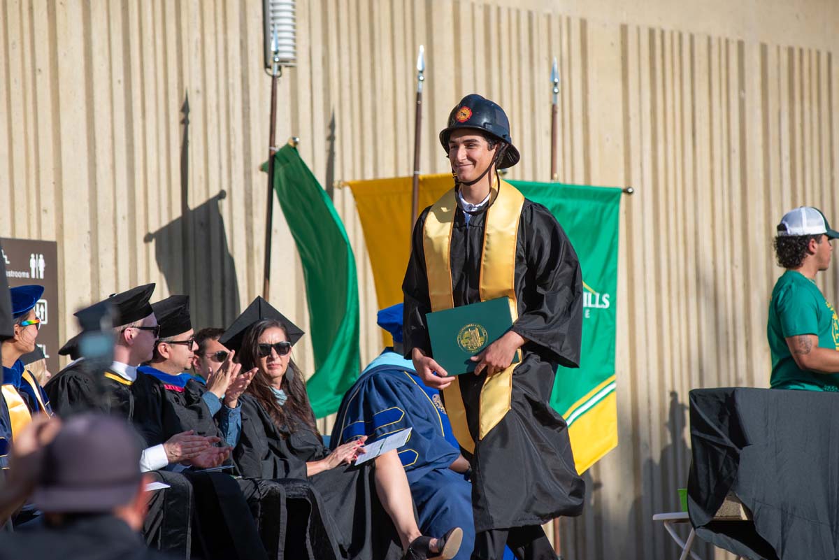 Grads walk across stage at CHC Commencement 2025.