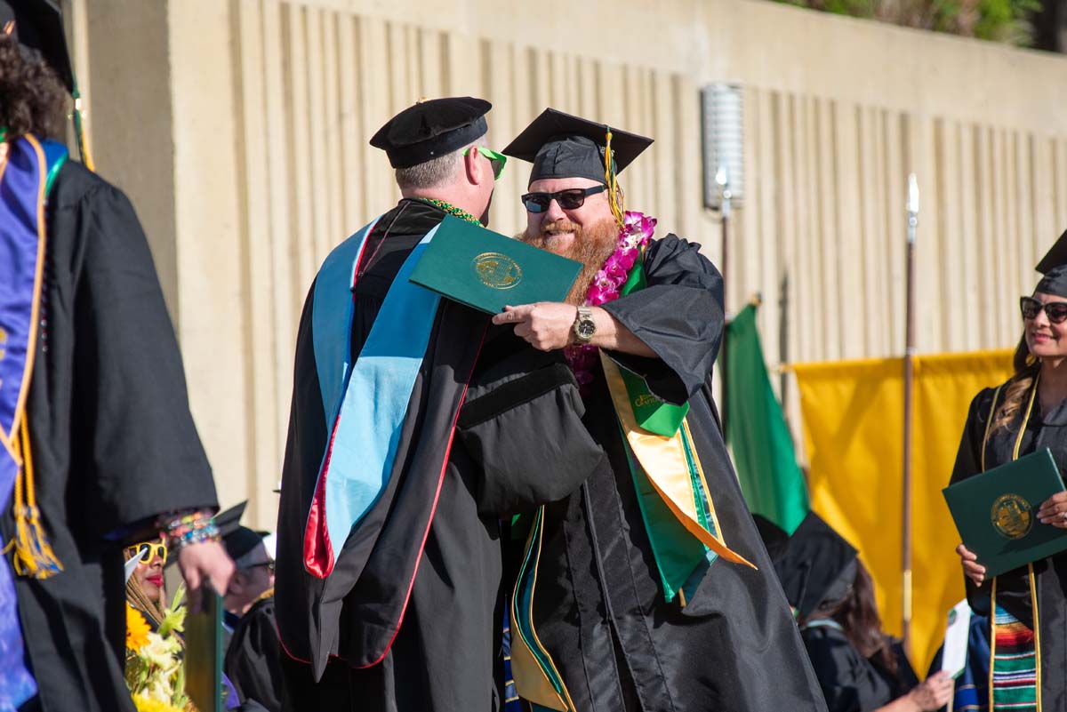 Grads walk across stage at CHC Commencement 2025.