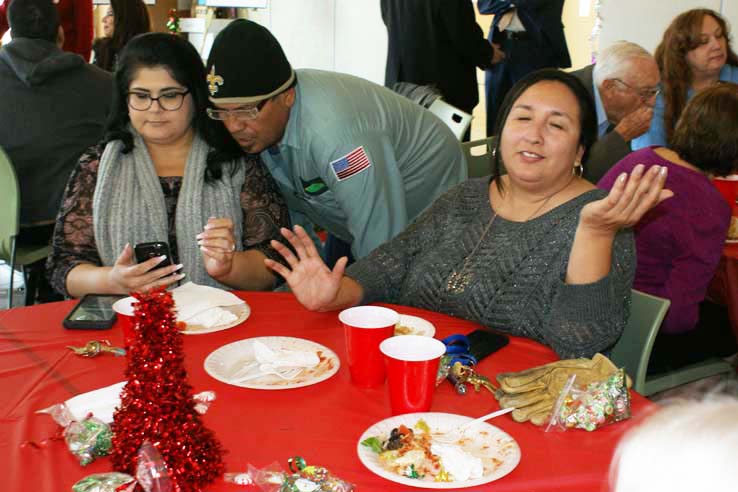 Faculty and staff at the holiday party.