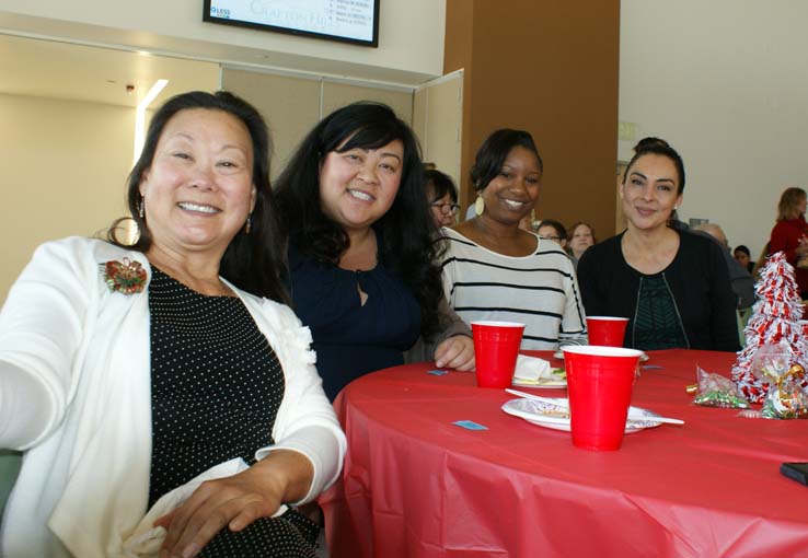 Faculty and staff at the holiday party.