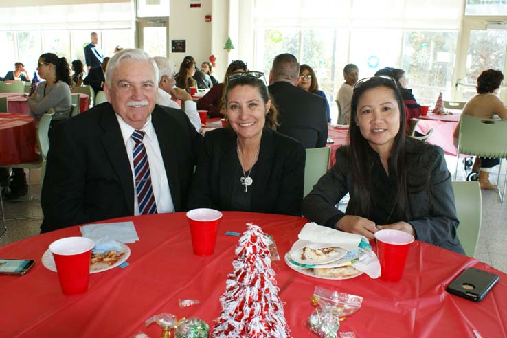 Faculty and staff at the holiday party.