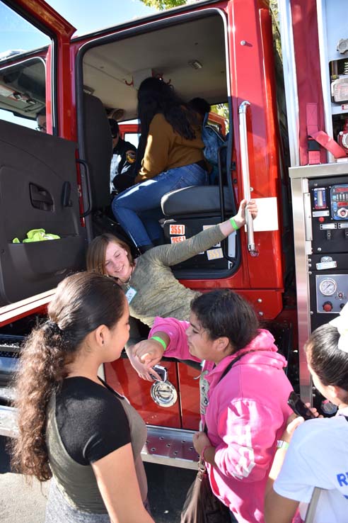 Ambulance and people at Allied Health and Medical Careers day