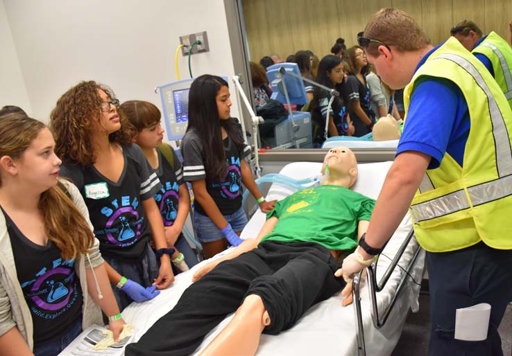 Ambulance and people at Allied Health and Medical Careers day