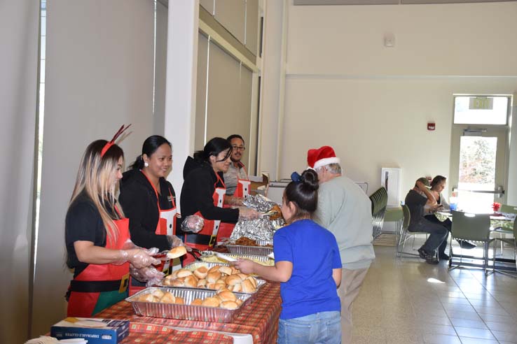 People enjoying the EOP&S Holiday Party