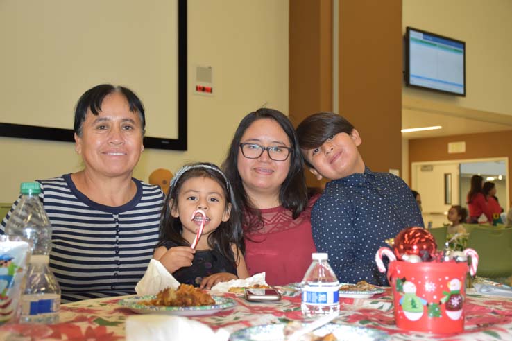 People enjoying the EOP&S Holiday Party