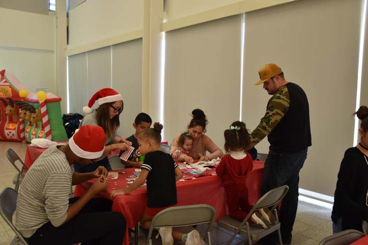 People enjoying the EOP&S Holiday Party