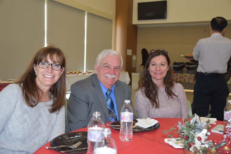 People enjoying the holiday party