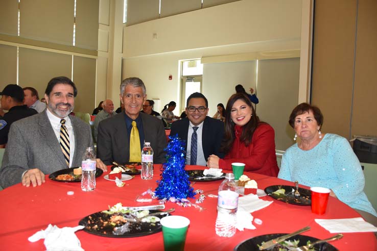 People enjoying the holiday party