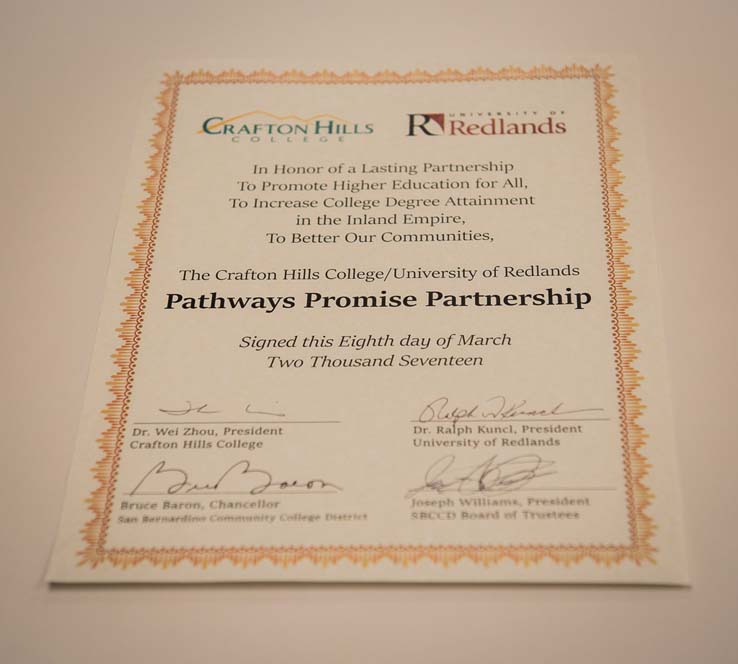 Signing an agreement for the Pathways Promise Partnership