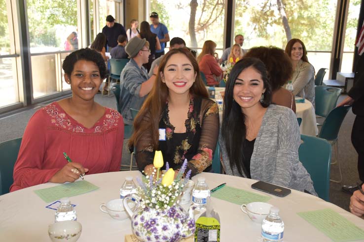 Students and faculty attend the spring Tea with the Deans event.