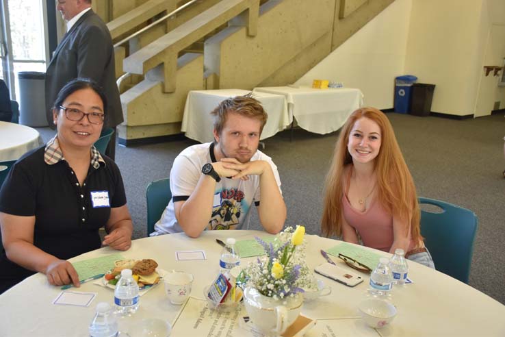 Students and faculty attend the spring Tea with the Deans event.