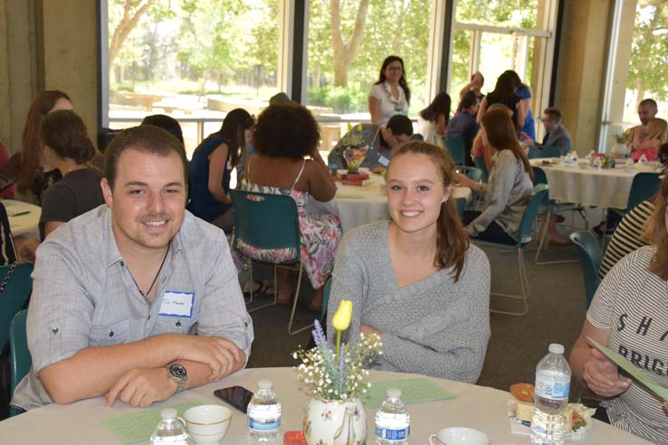 Students and faculty attend the spring Tea with the Deans event.