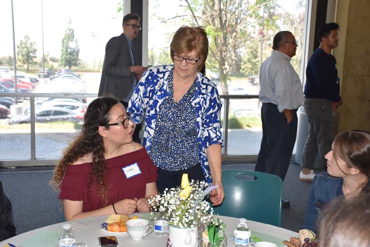 Students and faculty attend the spring Tea with the Deans event.