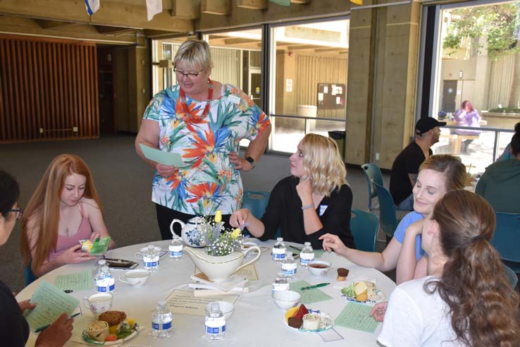 Students and faculty attend the spring Tea with the Deans event.