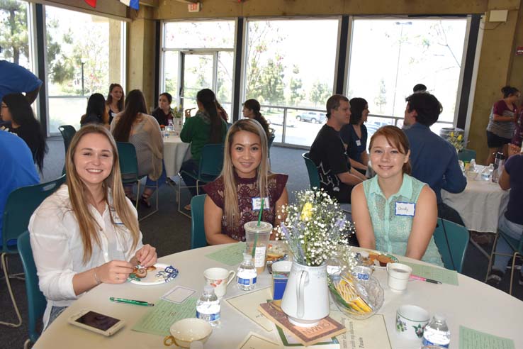 Students and faculty attend the spring Tea with the Deans event.