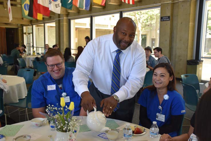 Students and faculty attend the spring Tea with the Deans event.