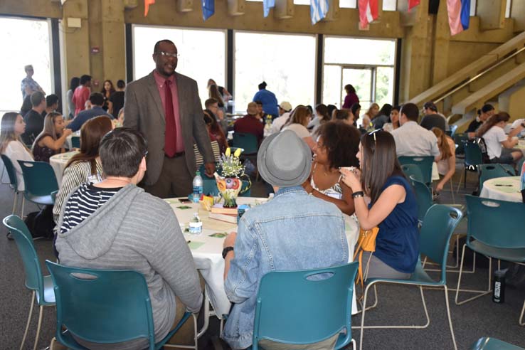 Students and faculty attend the spring Tea with the Deans event.