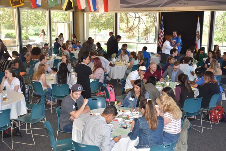 Students and faculty attend the spring Tea with the Deans event.