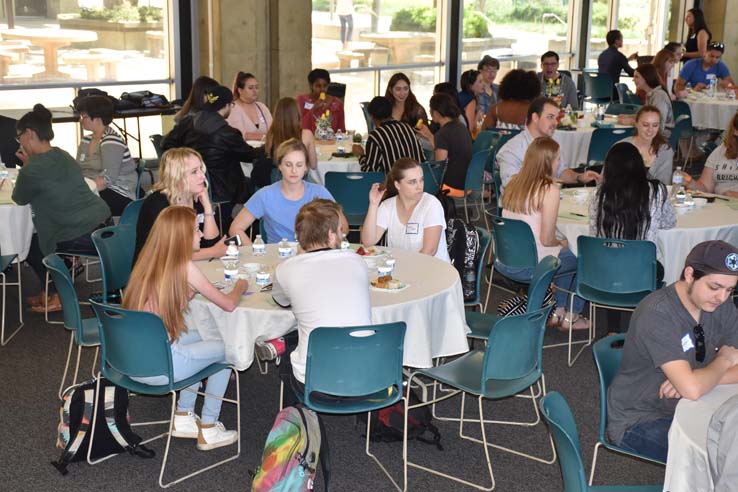 Students and faculty attend the spring Tea with the Deans event.