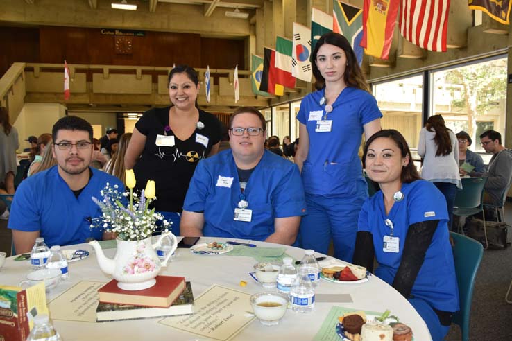 Students and faculty attend the spring Tea with the Deans event.