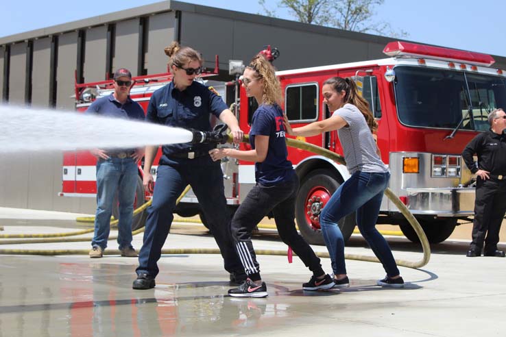 Participants in the open house undergoing a circuit.