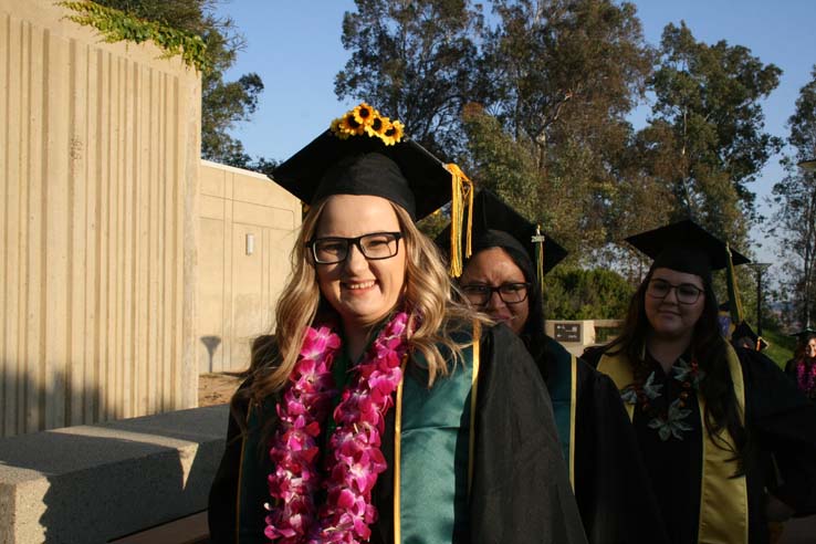 Students on walkway at Commencement