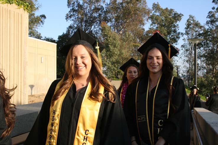 Students on walkway at Commencement