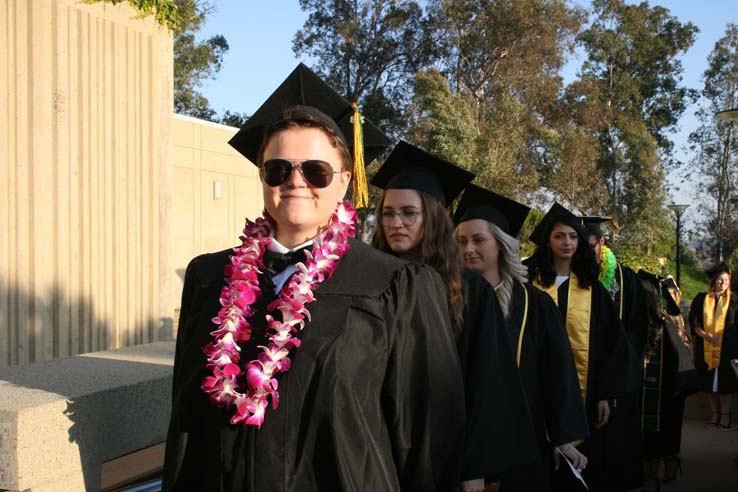 Students on walkway at Commencement