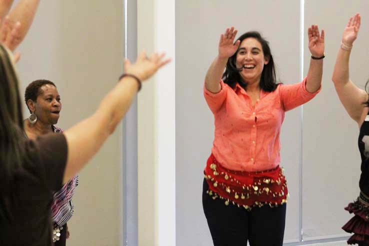 Staff practicing belly dancing