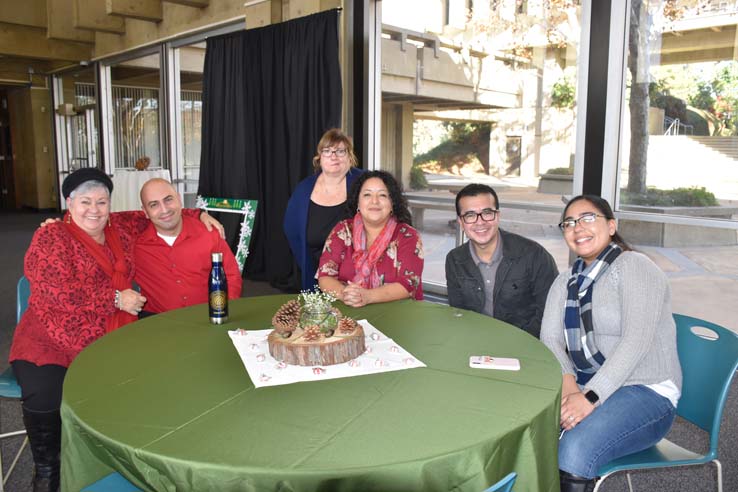 People enjoying the holiday reception