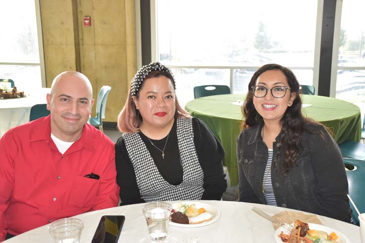 People enjoying the holiday reception