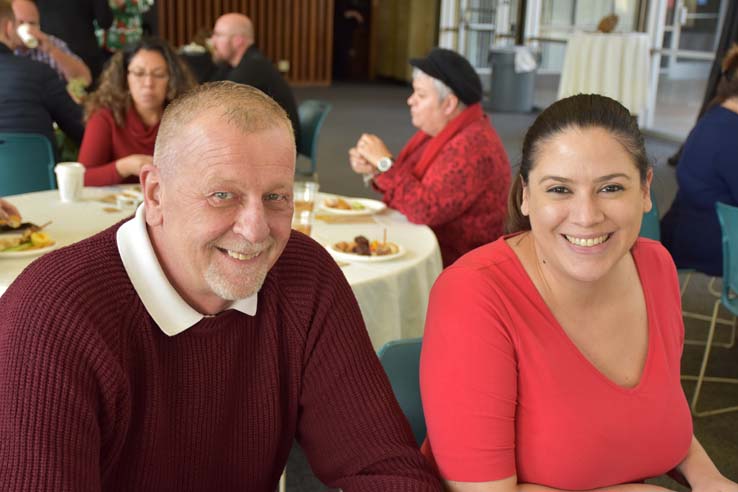 People enjoying the holiday reception