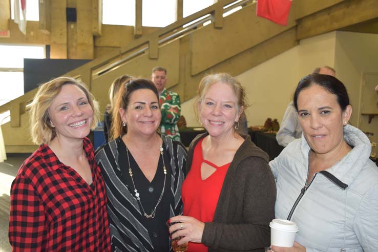 People enjoying the holiday reception