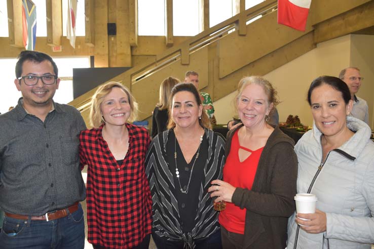 People enjoying the holiday reception