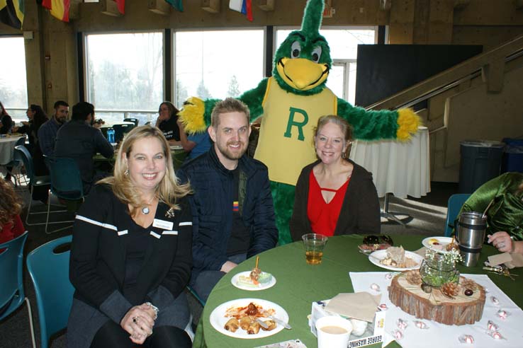 People enjoying the holiday reception