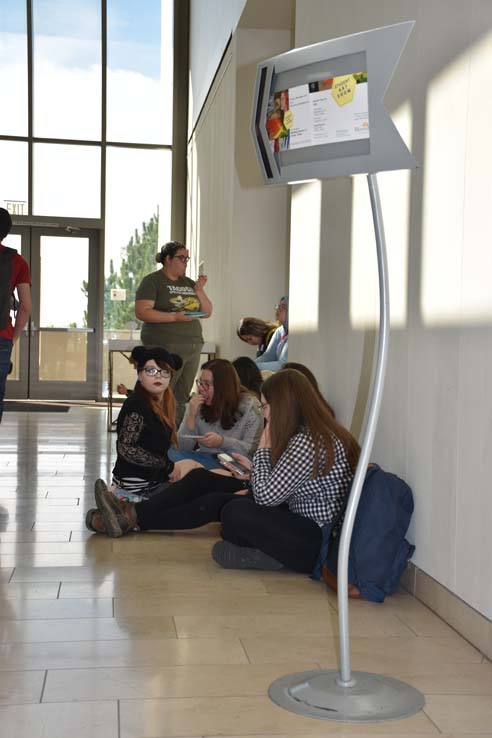 People enjoying the Student Art Exhibit