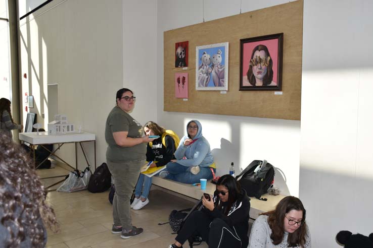 People enjoying the Student Art Exhibit