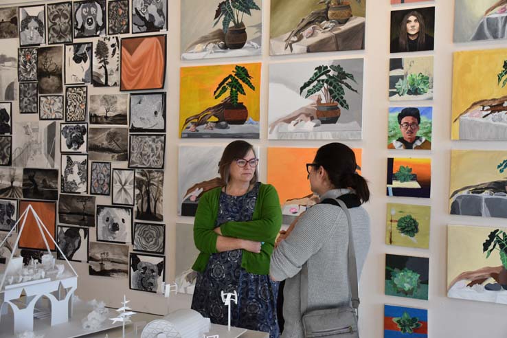 People enjoying the Student Art Exhibit