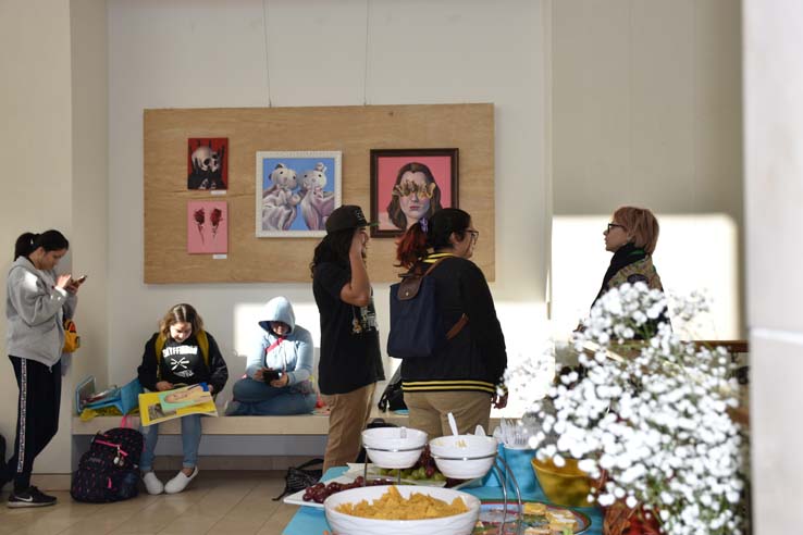 People enjoying the Student Art Exhibit
