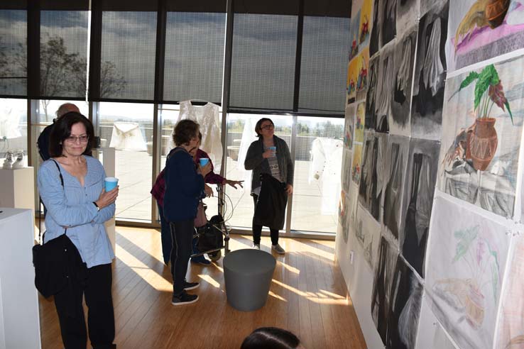 People enjoying the Student Art Exhibit