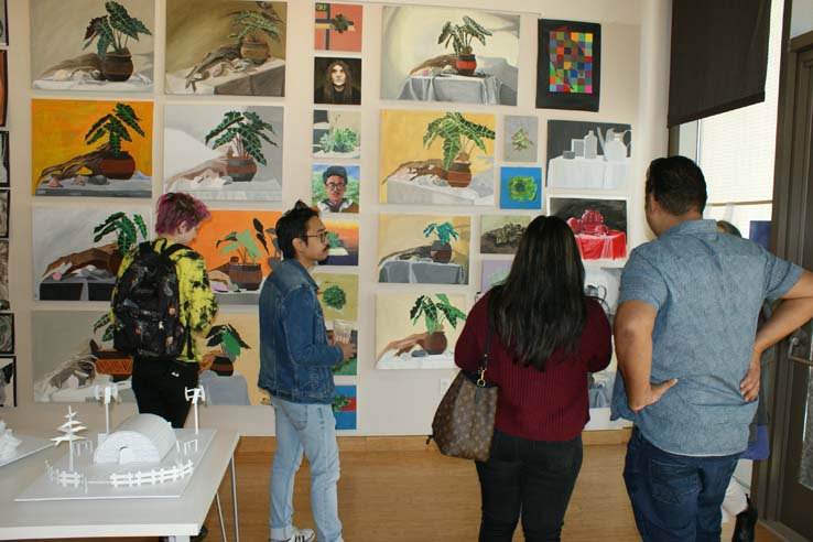 People enjoying the Student Art Exhibit